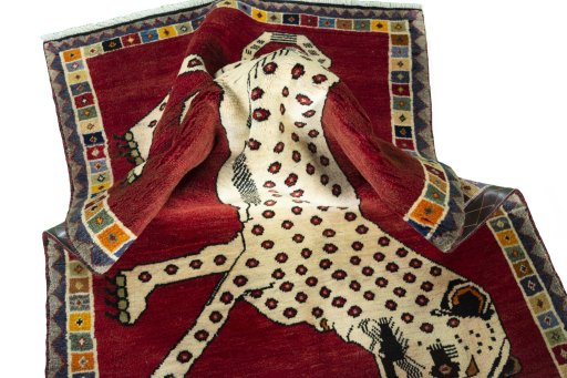 Corner detail of 2000s Persian Gabbeh rug showing border pattern and Wool pile
