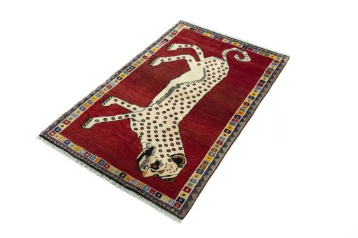 Corner detail of 2000s Persian Gabbeh rug showing border pattern and Wool pile