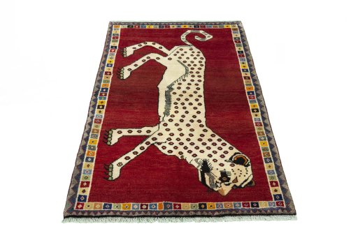 Surface texture of 2000s Persian Gabbeh rug with natural Wool and intricate pattern