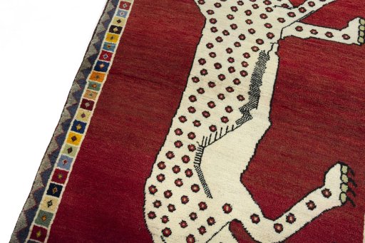 Backside of handmade 2000s Persian Gabbeh rug showing knot structure and weave density