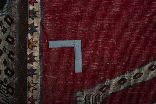 Corner detail of 2000s Persian Gabbeh rug showing border pattern and Wool pile