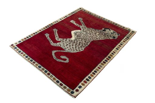 Corner detail of 2000s Persian Gabbeh rug showing border pattern and Wool pile