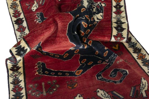 Corner detail of 2000s Persian Gabbeh rug showing border pattern and Wool pile