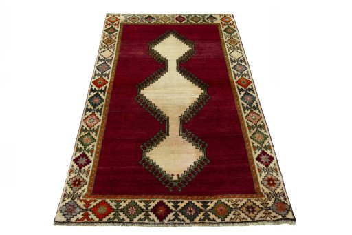Surface texture of 2000s Persian Gabbeh rug with natural Wool and intricate pattern