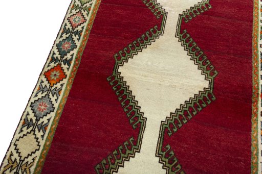 Backside of handmade 2000s Persian Gabbeh rug showing knot structure and weave density