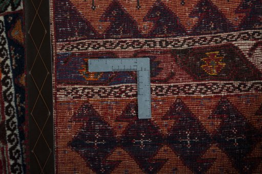 Corner detail of 2000s Persian Gabbeh rug showing border pattern and Wool pile