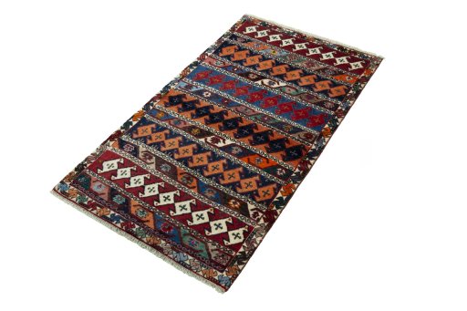 Corner detail of 2000s Persian Gabbeh rug showing border pattern and Wool pile