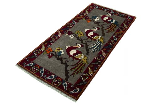 Corner detail of 2000s Persian Gabbeh rug showing border pattern and Wool pile