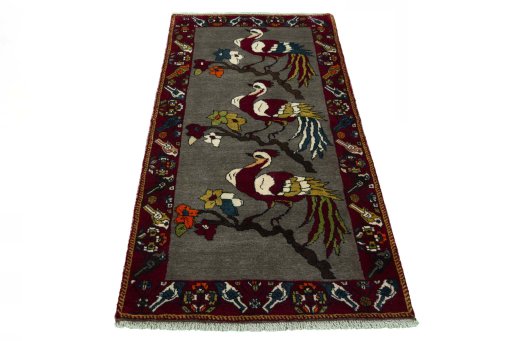 Surface texture of 2000s Persian Gabbeh rug with natural Wool and intricate pattern