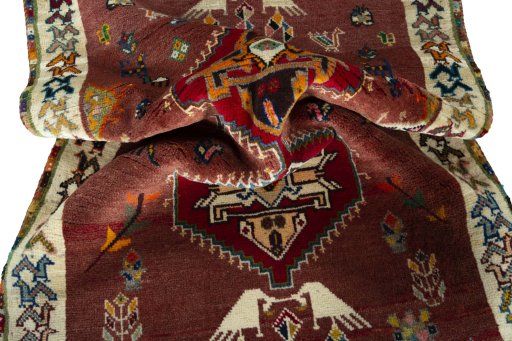 Corner detail of 2000s Persian Gabbeh rug showing border pattern and Wool pile