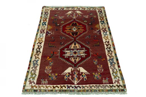 Surface texture of 2000s Persian Gabbeh rug with natural Wool and intricate pattern