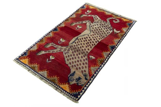 Corner detail of 2000s Persian Gabbeh rug showing border pattern and Wool pile