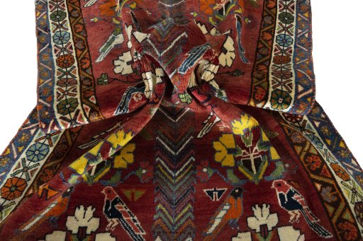 Corner detail of 1970s Persian Gabbeh rug showing border pattern and Wool pile