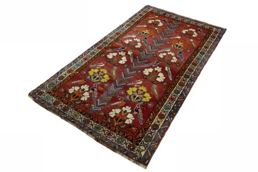 Corner detail of 1970s Persian Gabbeh rug showing border pattern and Wool pile