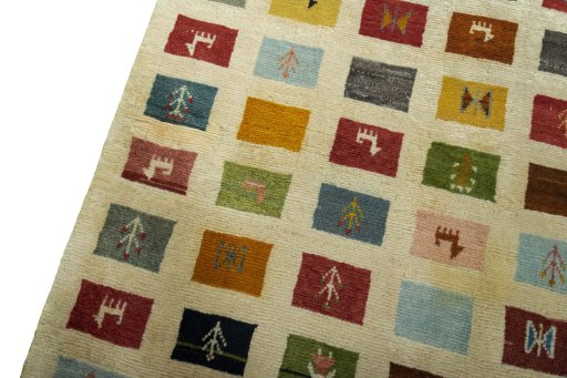 Backside of handmade 2000s Persian Gabbeh rug showing knot structure and weave density