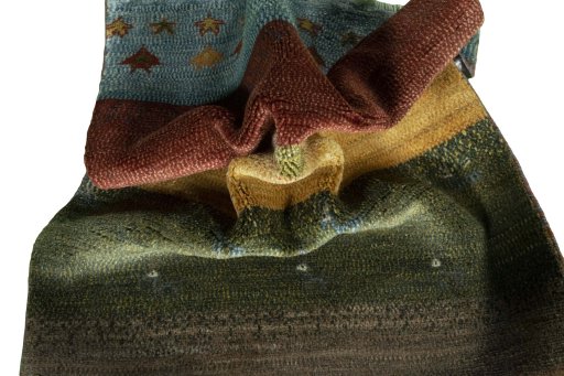 Corner detail of 2000s Persian Gabbeh rug showing border pattern and Wool pile