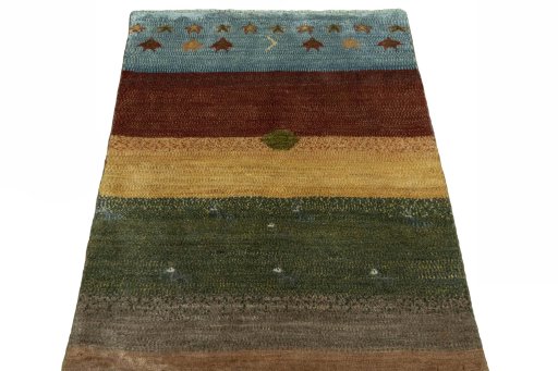Surface texture of 2000s Persian Gabbeh rug with natural Wool and intricate pattern