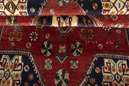Corner detail of 2000s Persian Gabbeh rug showing border pattern and Wool pile