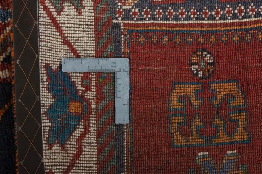 Surface texture of 2000s Persian Gabbeh rug with natural Wool and intricate pattern