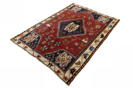 Corner detail of 2000s Persian Gabbeh rug showing border pattern and Wool pile