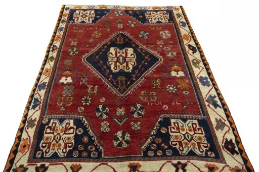Surface texture of 2000s Persian Gabbeh rug with natural Wool and intricate pattern