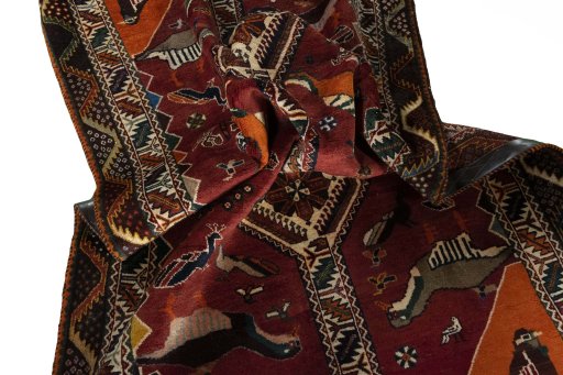 Corner detail of 2000s Persian Gabbeh rug showing border pattern and Wool pile