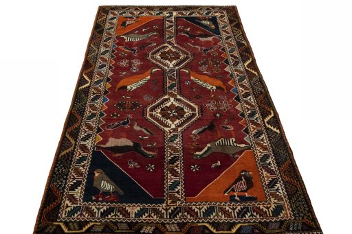 Surface texture of 2000s Persian Gabbeh rug with natural Wool and intricate pattern