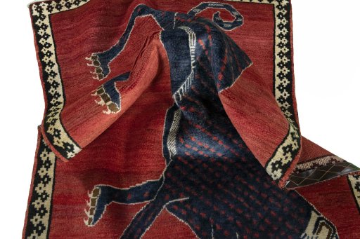 Corner detail of 2000s Persian Gabbeh rug showing border pattern and Wool pile