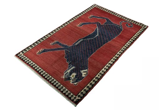 Corner detail of 2000s Persian Gabbeh rug showing border pattern and Wool pile