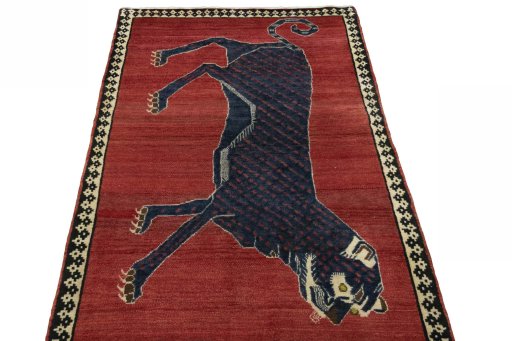 Surface texture of 2000s Persian Gabbeh rug with natural Wool and intricate pattern