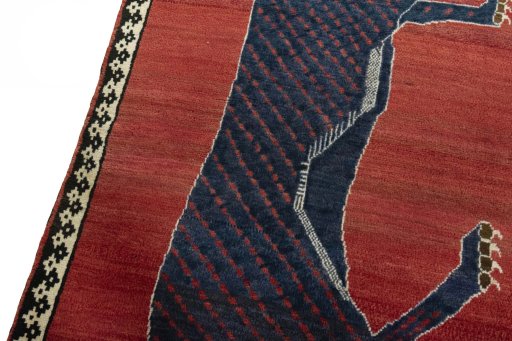 Backside of handmade 2000s Persian Gabbeh rug showing knot structure and weave density