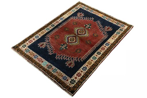 Corner detail of 2000s Persian Gabbeh rug showing border pattern and Wool pile