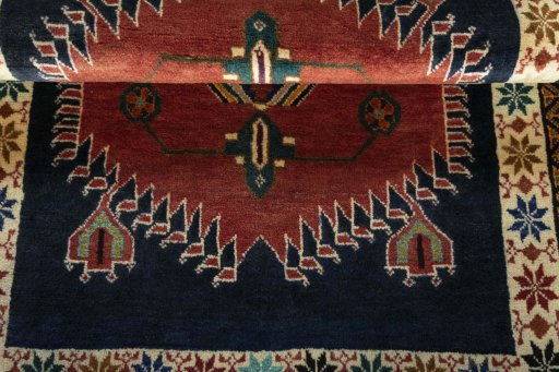 Full view of 2000s Persian Gabbeh rug from Iran / Persia, 142 × 102 cm in Red tones