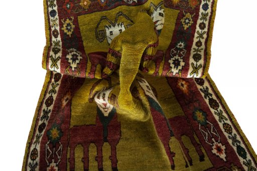 Corner detail of 2000s Persian Gabbeh rug showing border pattern and Wool pile