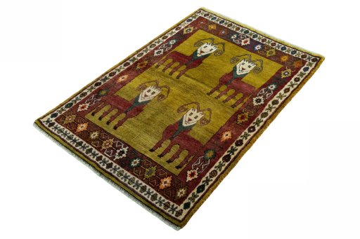 Corner detail of 2000s Persian Gabbeh rug showing border pattern and Wool pile