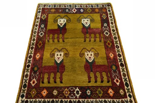 Surface texture of 2000s Persian Gabbeh rug with natural Wool and intricate pattern