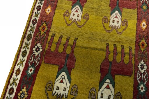 Backside of handmade 2000s Persian Gabbeh rug showing knot structure and weave density
