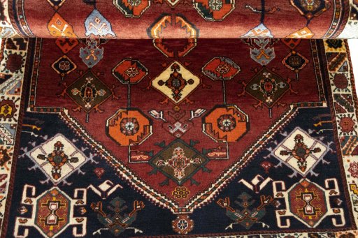 Corner detail of 2000s Persian Gabbeh rug showing border pattern and Wool pile