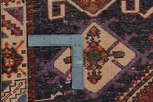 Surface texture of 2000s Persian Gabbeh rug with natural Wool and intricate pattern