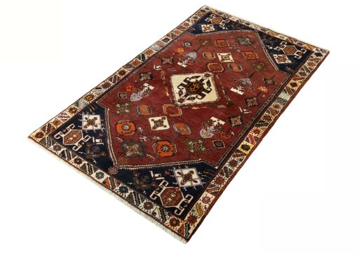 Corner detail of 2000s Persian Gabbeh rug showing border pattern and Wool pile