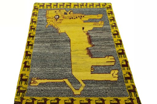 Surface texture of 2000s Persian Gabbeh rug with natural Wool and intricate pattern