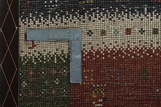 Close-up detail of 2000s Persian Gabbeh rug from Iran / Persia showing Wool weave