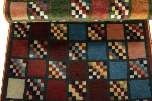 Full view of 2000s Persian Gabbeh rug from Iran / Persia, 134 × 82 cm in Multi Color tones