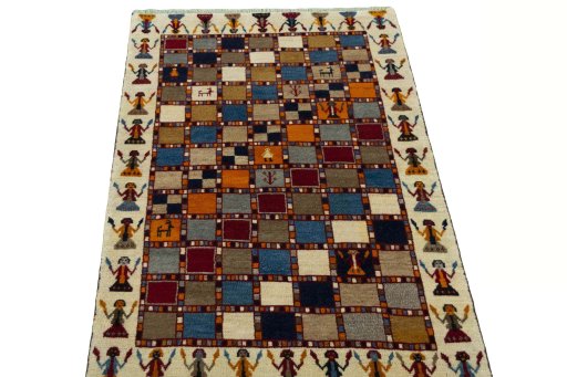 Surface texture of 2000s Persian Gabbeh rug with natural Wool and intricate pattern