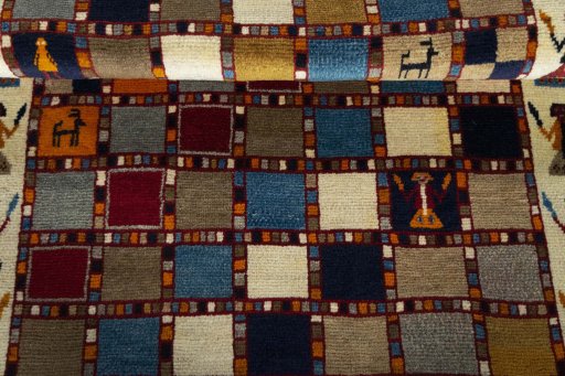 Full view of 2000s Persian Gabbeh rug from Iran / Persia, 168 × 107 cm in Multi Color tones