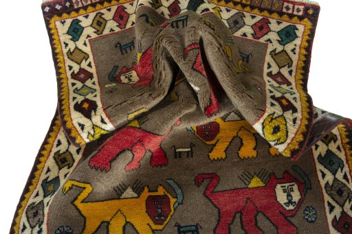 Corner detail of 2000s Persian Gabbeh rug showing border pattern and Wool pile