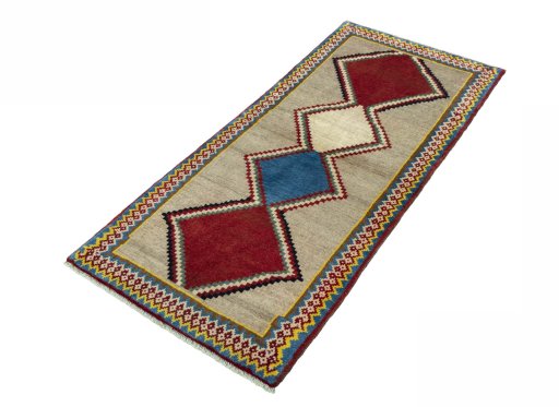 Corner detail of 2000s Persian Gabbeh rug showing border pattern and Wool pile