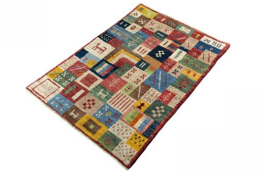 Corner detail of 2000s Persian Gabbeh rug showing border pattern and Wool pile