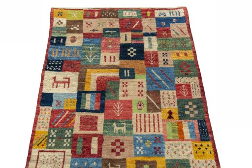 Surface texture of 2000s Persian Gabbeh rug with natural Wool and intricate pattern