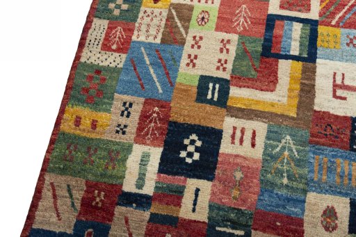 Backside of handmade 2000s Persian Gabbeh rug showing knot structure and weave density